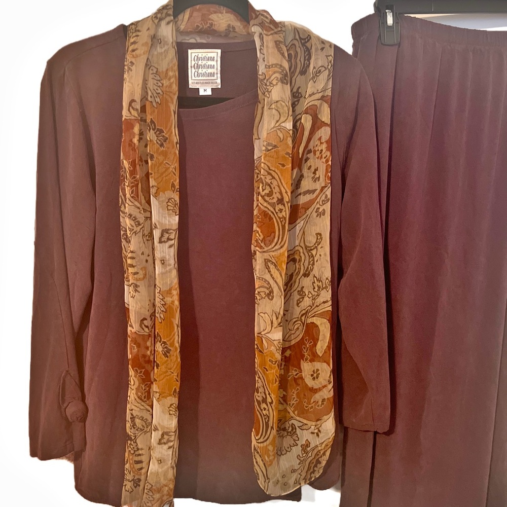 Elegant and chic long skirt and top. It’s a beautiful deep plum. size medium